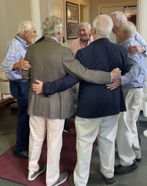 group of men embracing