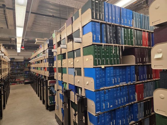 bookshelves of braille